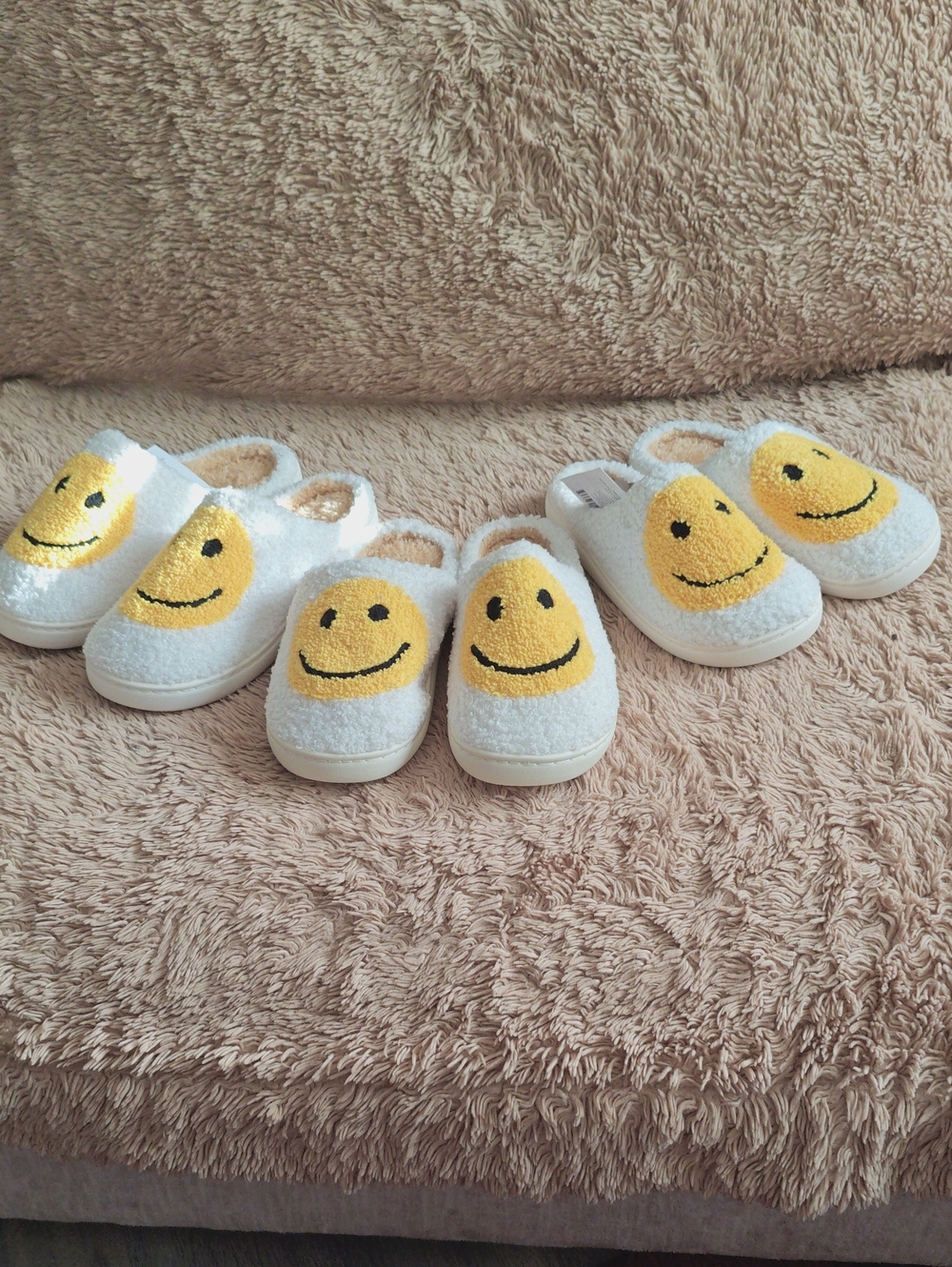 Three Pairs of Smiley Face Slippers In Graduating Sizes